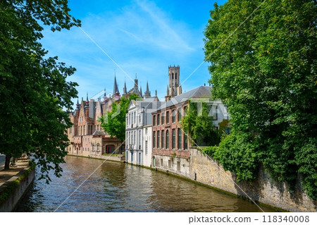 Scenic canal with trees and colorful historic buildings in Bruges, Belgium Scenic canal with trees and colorful historic buildings in Bruges, Belgium 118340008