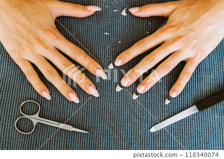 women's hands with manicure, one hand with trimmed nails women's hands with manicure, one hand with trimmed nails 118340074