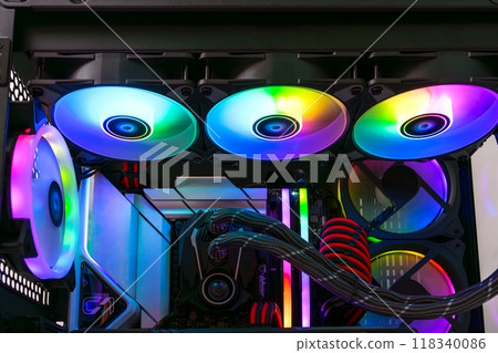 Computer case with multiple cooling fans illuminated with bright rainbow colors. Computer case with multiple cooling fans illuminated with bright rainbow colors. 118340086