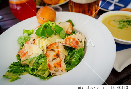 Savory Chicken Caesar Salad with Fresh Greens and Parmesan Cheese 118340110
