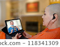 Patient receives breast cancer consultation via tablet as doctor explains ultrasound results remotely, illustrating modern healthcare communication. 118341309