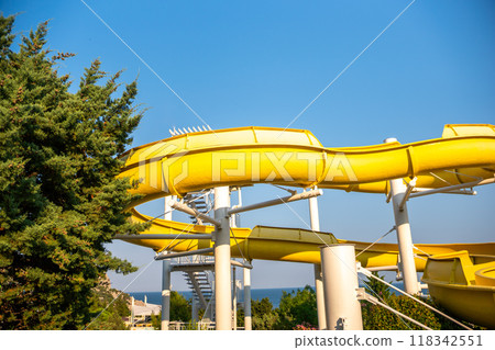Water Slide, Park, Summer: Yellow water slide at a park on a sunny day. 118342551
