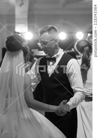 Elegant Black and White Wedding Dance Capturing Romantic Moments on the Dance Floor 118343364
