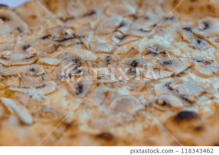 Gourmet Mushroom and Cheese Pizza with Rustic Crust Captured in Close-Up View Gourmet Mushroom and Cheese Pizza with Rustic Crust Captured in Close-Up View 118343462