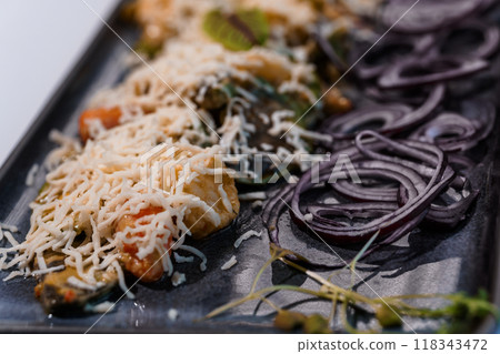 Exquisite Gourmet Pasta with Fresh Vegetables and Grated Cheese on Elegant Serving Platter Exquisite Gourmet Pasta with Fresh Vegetables and Grated Cheese on Elegant Serving Platter 118343472