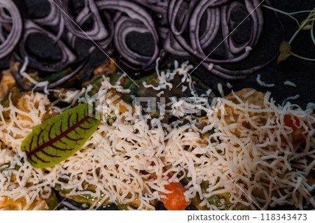 Gourmet Culinary Presentation of Vibrant Pasta Dish with Creamy Sauce Garnished with Purple Onion Slices and Fresh Herbs Gourmet Culinary Presentation of Vibrant Pasta Dish with Creamy Sauce Garnished with Purple Onion Slices and Fresh Herbs 118343473
