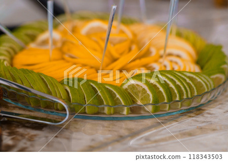 Exquisite Fruit Platter Display Featuring Freshly Sliced Citrus Medley 118343503