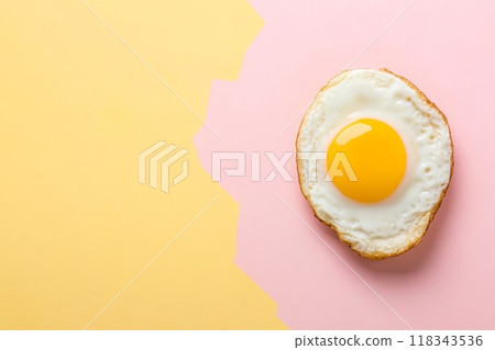Fried egg beautifully displayed against vibrant and colorful background Fried egg beautifully displayed against vibrant and colorful background 118343536