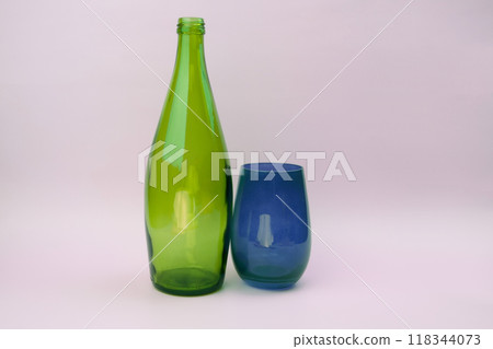 Colorful glass bottle and empty glass background 118344073