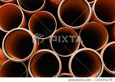 brown plastic plumbing pipes with rubber seals 118344276