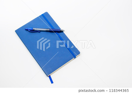 Blue pen and notepad on a white background, notebook with blank sheet Blue pen and notepad on a white background, notebook with blank sheet 118344365