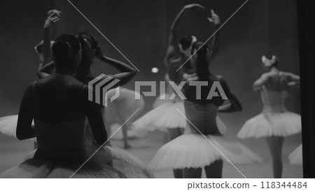 Ballerinas in white tutus, view from backstage. Black and white photos Ballerinas in white tutus, view from backstage. Black and white photos 118344484