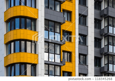 freshly built white-grey-yellow high rise apartment building, full-frame closeup freshly built white-grey-yellow high rise apartment building, full-frame closeup 118345268