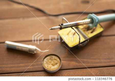 Soldering iron placed on the iron stand Soldering iron placed on the iron stand 118346776