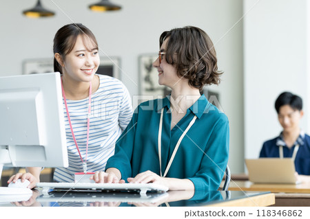 Foreign and Japanese staff working in an office Foreign and Japanese staff working in an office 118346862