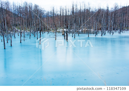 A blue pond with frozen lake surface Bieicho 118347109