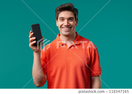 Young handsome man listening music by wireless portable speaker - sound system 118347165