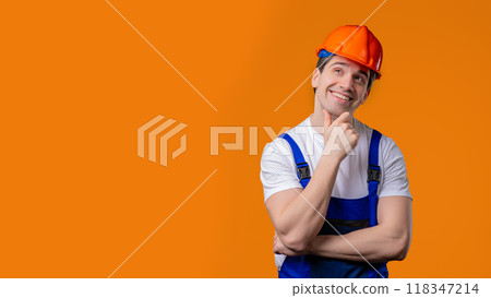 Thinking around mature handyman worker or builder man on orange. Copy space. 118347214