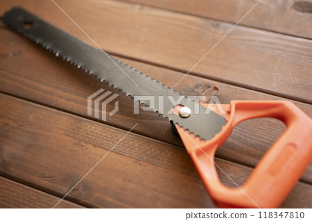 A well-used builder's saw 118347810