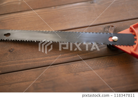 A well-used builder's saw 118347811