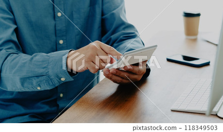 Men's hand calculating with a calculator 118349503