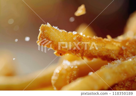 Crispy French Fry with Salt Crystals and Chicken Finger in Background 118350189