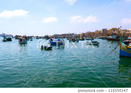 Lutz, a small fishing boat decorating the harbor of Marsaxlokk, a fishing village in Malta 118350347