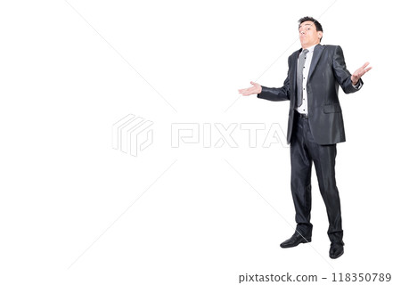 Confused male worker shrugging shoulders in studio Confused male worker shrugging shoulders in studio 118350789