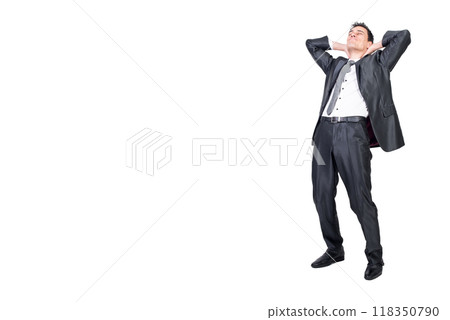 Relaxed man in formal wear standing with hands behind head Relaxed man in formal wear standing with hands behind head 118350790