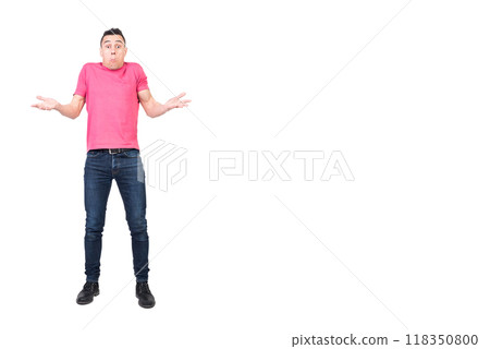 Young male shrugging shoulders and looking puzzled in studio Young male shrugging shoulders and looking puzzled in studio 118350800