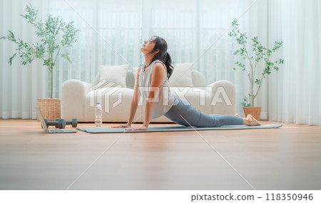 Young Asian woman stretching yoga workout on exercise mat 118350946