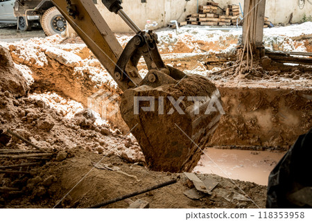 A significant pile of ground is being excavated by a bulldozer 118353958