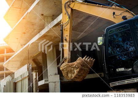 A significant pile of ground is being excavated by a bulldozer 118353983