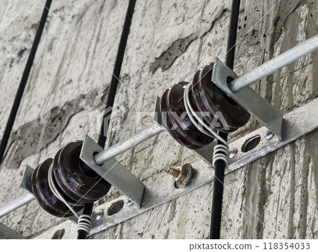 Cables in an elevator shaft at a new building construction site 118354033