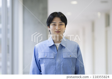 Young man in work clothes, looking at camera, portrait 118355824