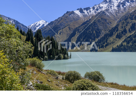 Beautiful mountain lake, forest and mountains. Big Almaty lake in summer time. Mountain landscape in Kazakhstan. Beautiful mountain lake, forest and mountains. Big Almaty lake in summer time. Mountain landscape in Kazakhstan. 118356654