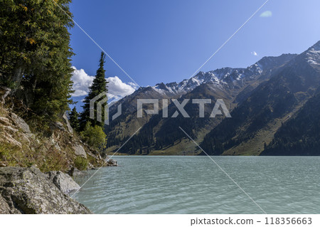 Beautiful mountain lake, forest and mountains. Big Almaty lake in summer time. Mountain landscape in Kazakhstan. Beautiful mountain lake, forest and mountains. Big Almaty lake in summer time. Mountain landscape in Kazakhstan. 118356663