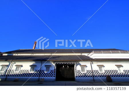 A sake brewery with sunlight hitting certain spots A sake brewery with sunlight hitting certain spots 118357139