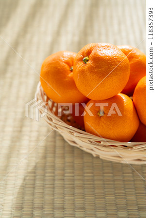 Mandarin oranges in a basket 118357393