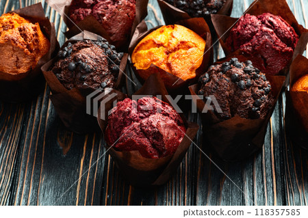 Mix of muffins ( cupcake ) chocolate , vanilla , berries . Top view Mix of muffins ( cupcake ) chocolate , vanilla , berries . Top view 118357585