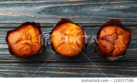 Sweet Baked vanilla muffins ( cupcake )  . Top view 118357586