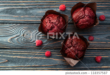 Sweet Baked berries muffins ( cupcake )  . Top view 118357587