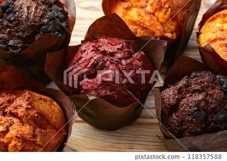 Mix of muffins ( cupcake ) chocolate , vanilla , berries . Top view Mix of muffins ( cupcake ) chocolate , vanilla , berries . Top view 118357588