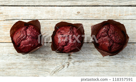 Sweet Baked berries muffins ( cupcake )  . Top view 118357591