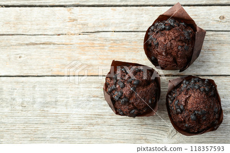 Sweet Baked chocolate muffins ( cupcake ) . Top view Sweet Baked chocolate muffins ( cupcake ) . Top view 118357593