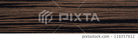 Elegant ebony wood with rich dark brown hues and striking black streaks 118357812