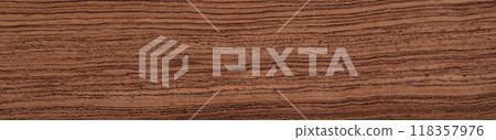 Bubinga veneer with distinctive wave patterns and warm reddish hues 118357976
