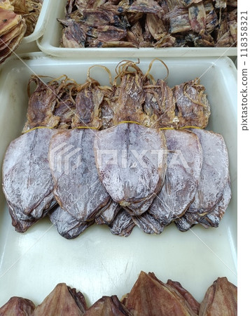 dried squid on plastic tray for sale in Thai local market dried squid on plastic tray for sale in Thai local market 118358321