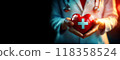 Hands of a Female Doctor Holding a Red Heart with White Cross - Generative Ai 118358524