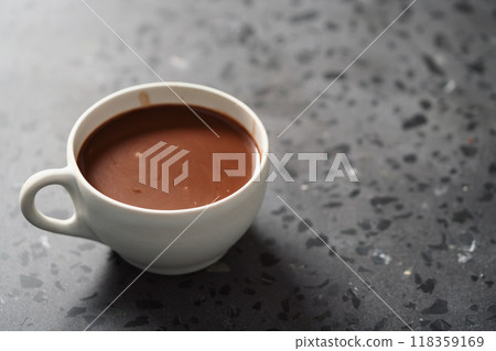 Cocoa drink in white cup on terrazzo surface with copy space 118359169